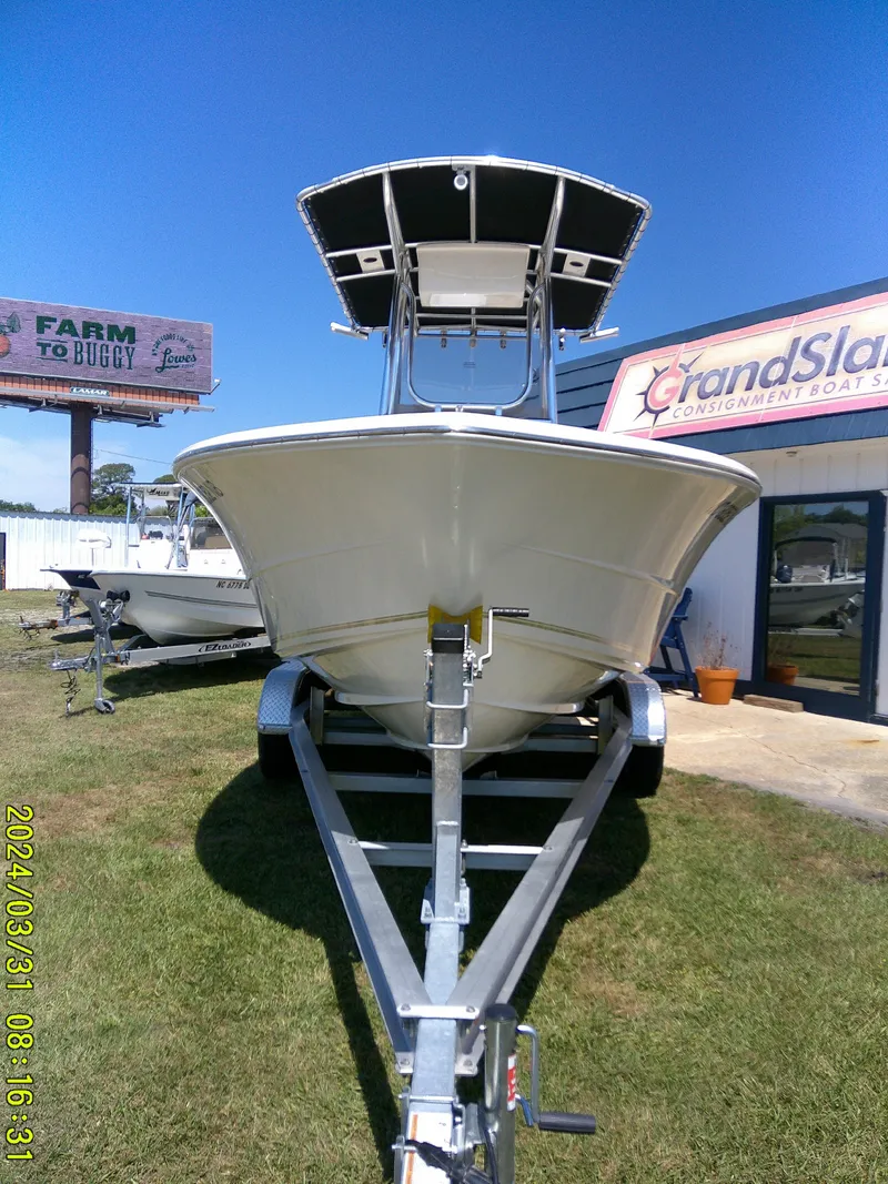 Slide: The Image of 2024 Bulls Bay 200 CC boat on trailer, displayed outdoors under clear blue sky. - 3