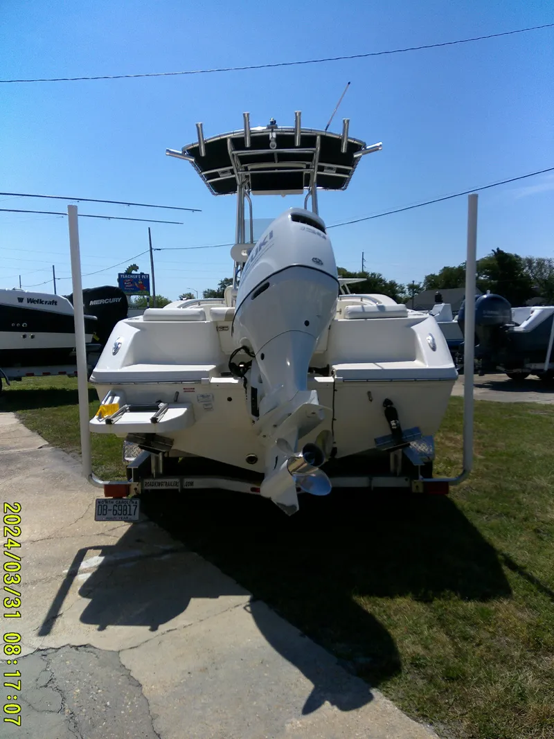 Slide: The Image of 2024 Bulls Bay 200 CC boat, rear view with outboard motor, parked outdoors. - 6