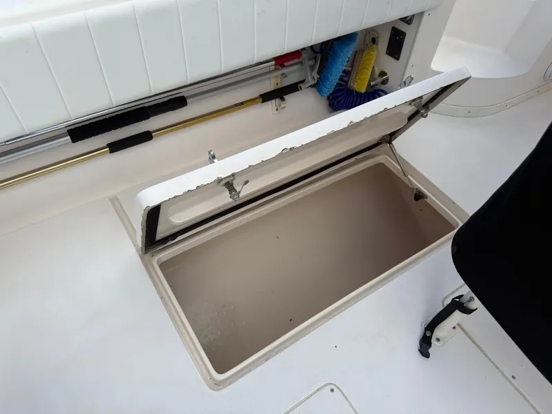 Slide: The Image of Open storage compartment on a 2006 Intrepid 350 Center Console boat deck. - 18