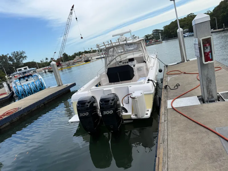Slide: The Image of 2006 Intrepid 350 Center Console boat docked with dual 300 horsepower engines. - 21