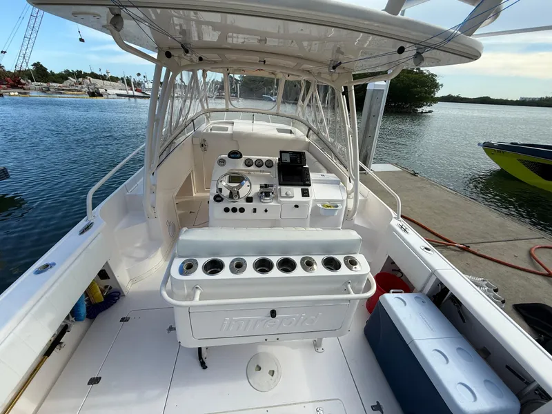 Slide: The Image of 2006 Intrepid 350 Center Console boat interior with helm, seating, and water view. - 3