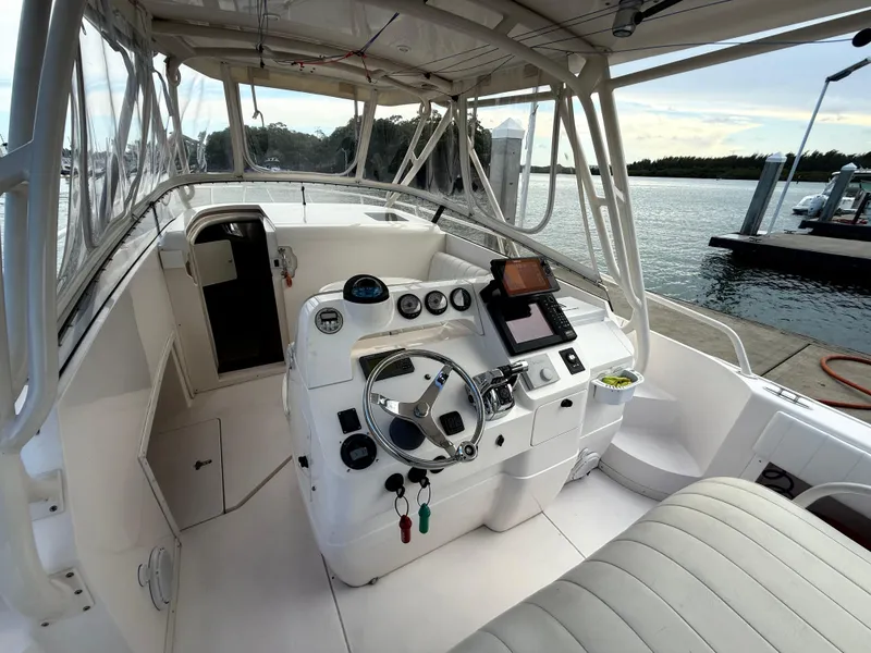 Slide: The Image of 2006 Intrepid 350 Center Console boat interior with steering wheel and navigation equipment. - 4