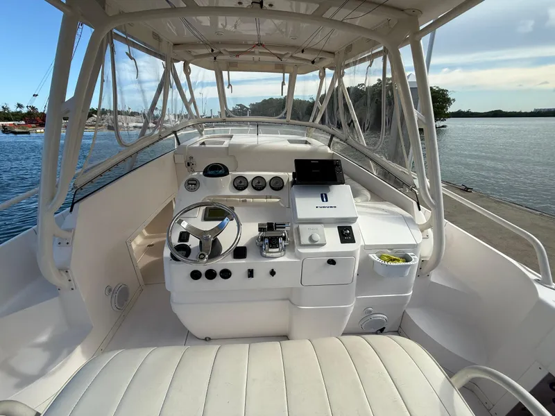 Slide: The Image of 2006 Intrepid 350 Center Console boat interior with steering wheel and control panel. - 5