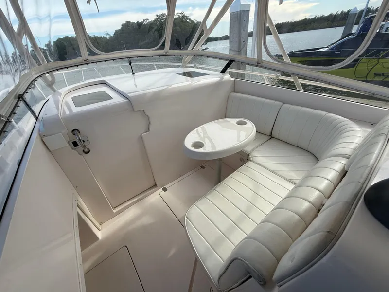 Slide: The Image of 2006 Intrepid 350 Center Console boat interior with white seating and small table. - 7