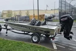 Slide: The Image of 2023 Tracker Pro Team 175 boat on trailer in parking lot. - 3