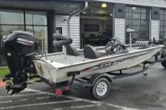 Slide: The Image of 2023 Tracker Pro Team 175 boat on trailer outside dealership. - 4