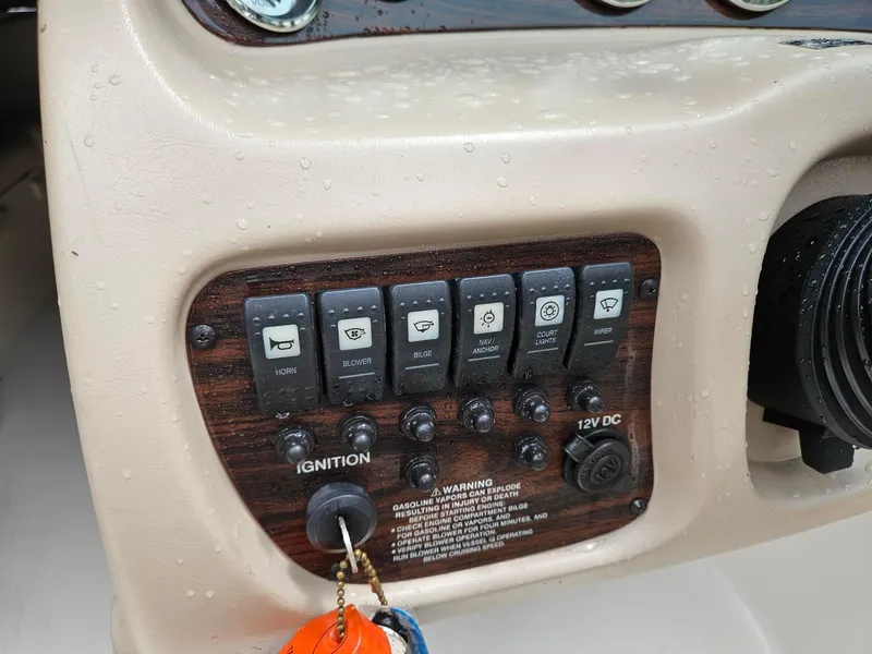 Slide: The Image of Control panel of a 2000 Chaparral 230 SSi boat with ignition and switches. - 10