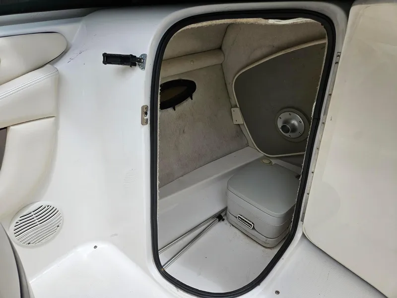 Slide: The Image of Interior cabin of 2000 Chaparral 230 SSi boat with storage and speaker. - 7