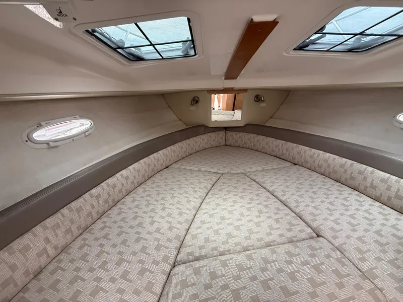 Slide: The Image of 2025 Cutwater C-248 Coupe interior cabin with skylights and patterned upholstery. - 16