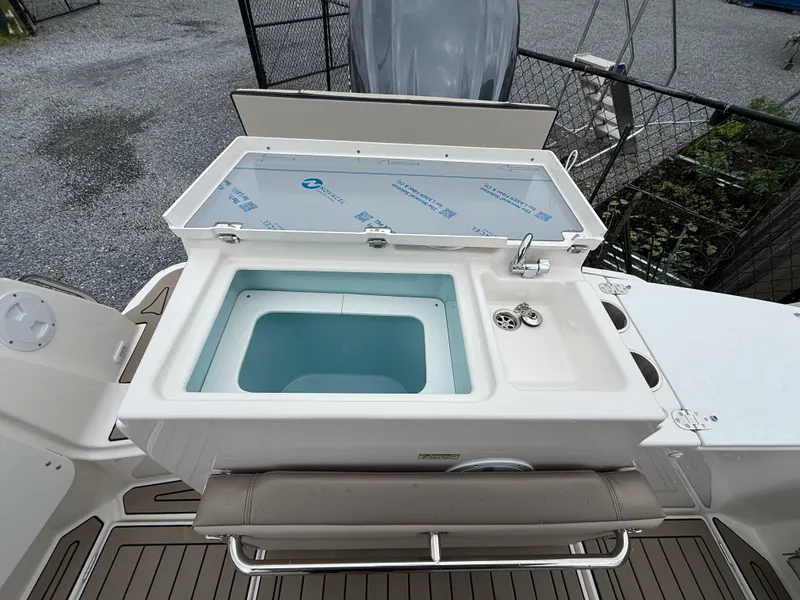 Slide: The Image of 2025 Cutwater C-248 Coupe boat sink and storage area on deck. - 7