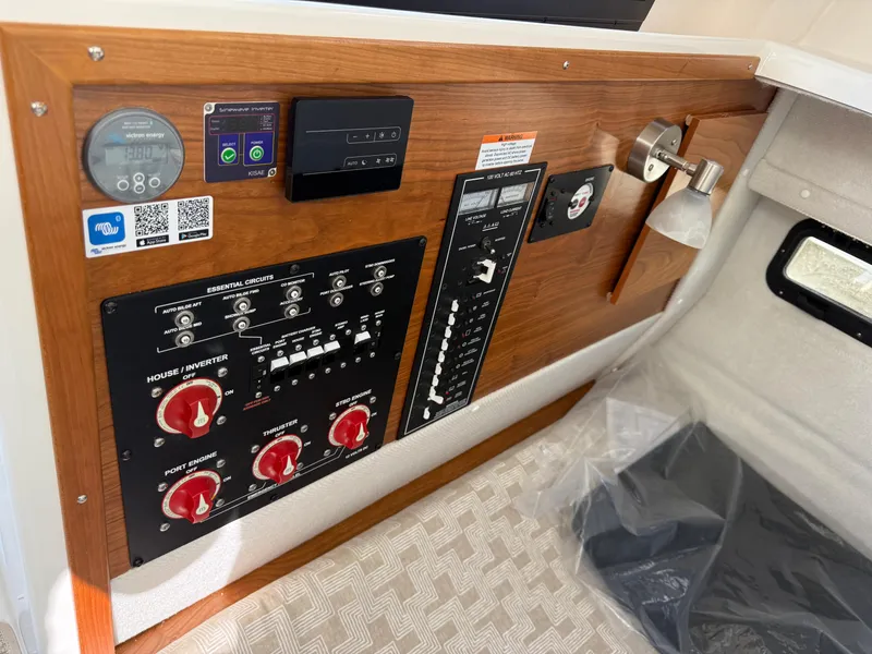 Slide: The Image of Control panel of 2025 Cutwater C-288 Coupe boat with switches and gauges. - 26