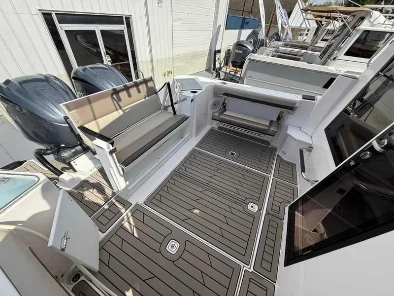 Slide: The Image of 2025 Cutwater C-288 Coupe boat deck with seating and twin engines. - 7