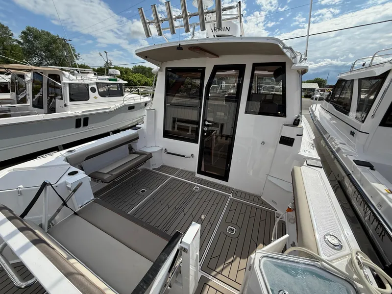 Slide: The Image of 2025 Cutwater C-288 Coupe boat with spacious deck and modern design. - 8