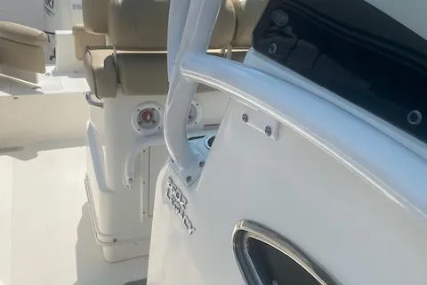 Slide: The Image of 2018 NauticStar 2602 Legacy boat interior with seating and console details. - 10