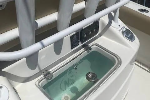 Slide: The Image of 2018 NauticStar 2602 Legacy boat livewell and rod holders. - 13