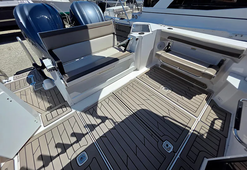 Slide: The Image of 2025 Cutwater C-288 Coupe boat deck with seating and twin engines. - 3