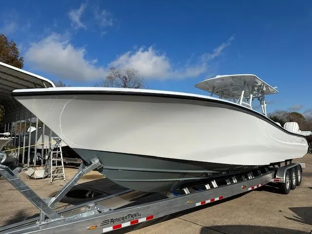 Slide: The Image of 2024 Yellowfin 36 Offshore boat on trailer under clear blue sky. - 0