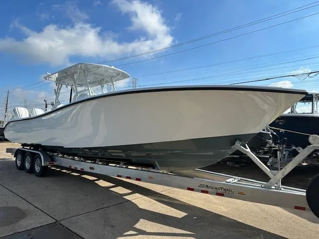 Slide: The Image of 2024 Yellowfin 36 Offshore boat on trailer under clear sky. - 2