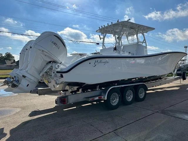 Slide: The Image of 2024 Yellowfin 36 Offshore boat on trailer, featuring Yamaha engines, under a clear blue sky. - 3