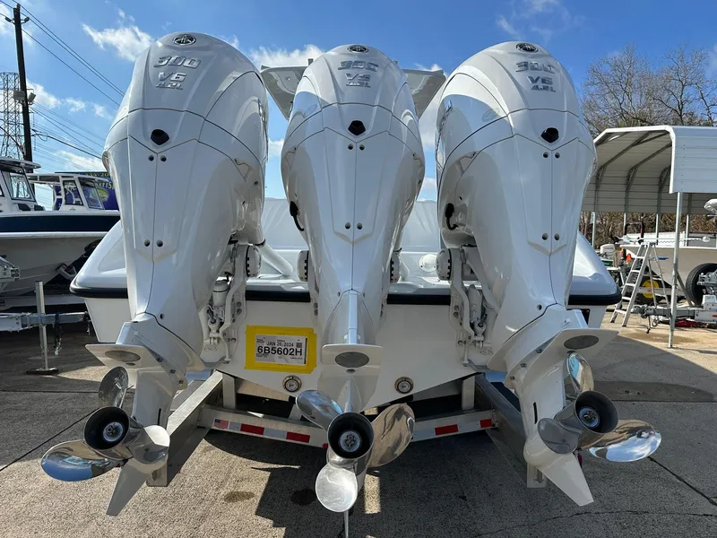 Slide: The Image of 2024 Yellowfin 36 Offshore boat with triple outboard engines, rear view. - 5