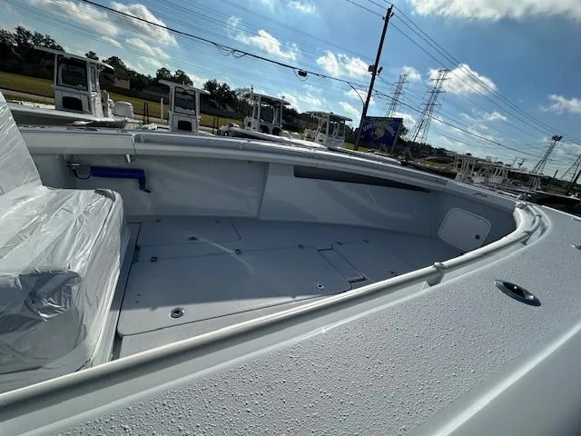 Slide: The Image of 2024 Yellowfin 36 Offshore boat deck under clear blue sky. - 8