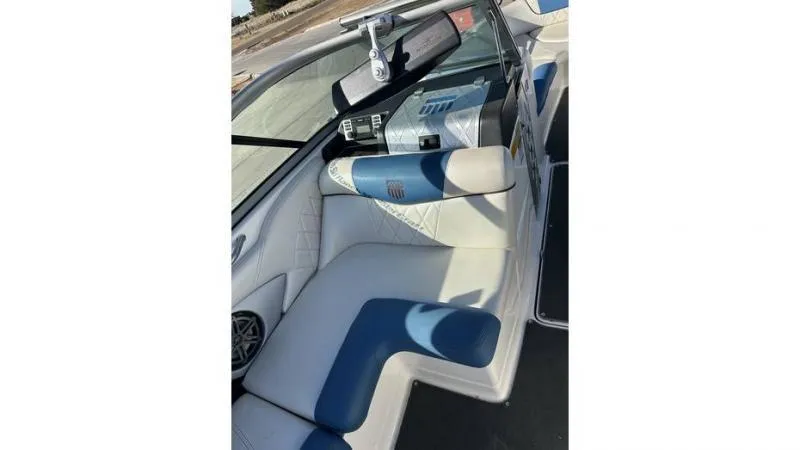Slide: The Image of 2012 MasterCraft X45 boat interior with blue and white seating. - 10