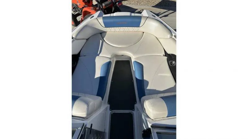 Slide: The Image of 2012 MasterCraft X45 boat interior with white and blue seating. - 2