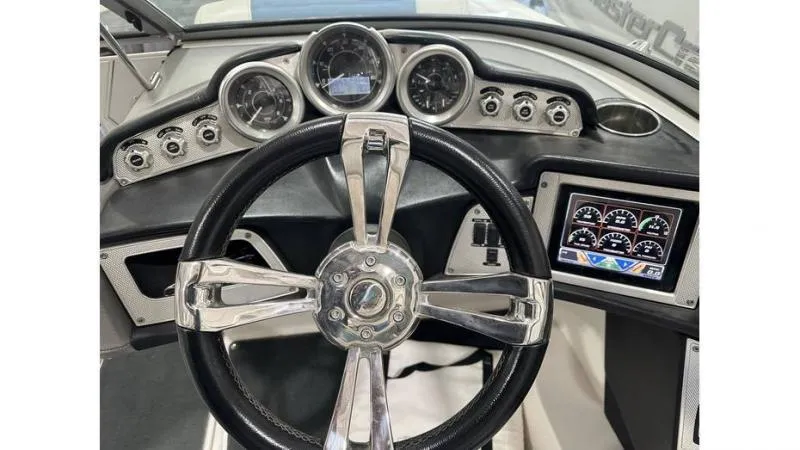 Slide: The Image of 2012 MasterCraft X45 dashboard with steering wheel and instrument panel. - 3