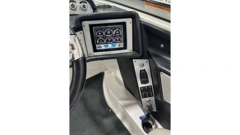 Slide: The Image of 2012 MasterCraft X45 dashboard with digital display and controls. - 5