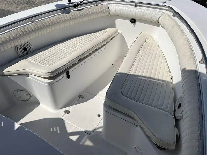 Slide: The Image of 2006 Sea Hunt Triton 260 boat interior with cushioned seating and storage compartments. - 19