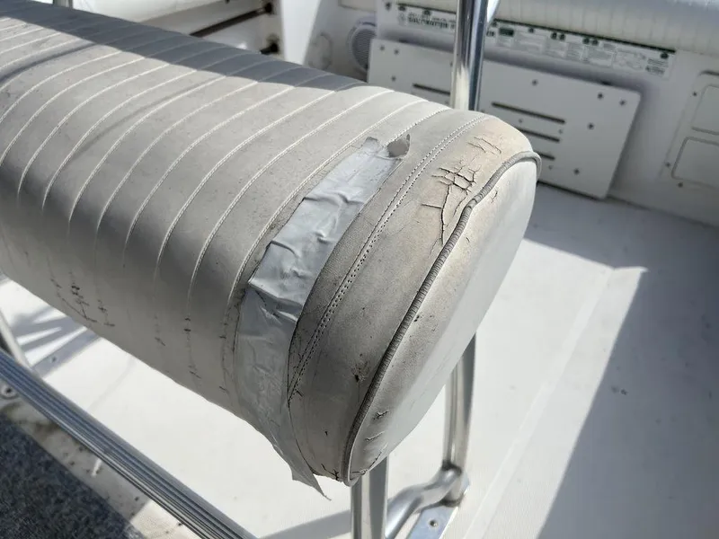 Slide: The Image of Worn seat on 2006 Sea Hunt Triton 260 boat with visible duct tape repair. - 29