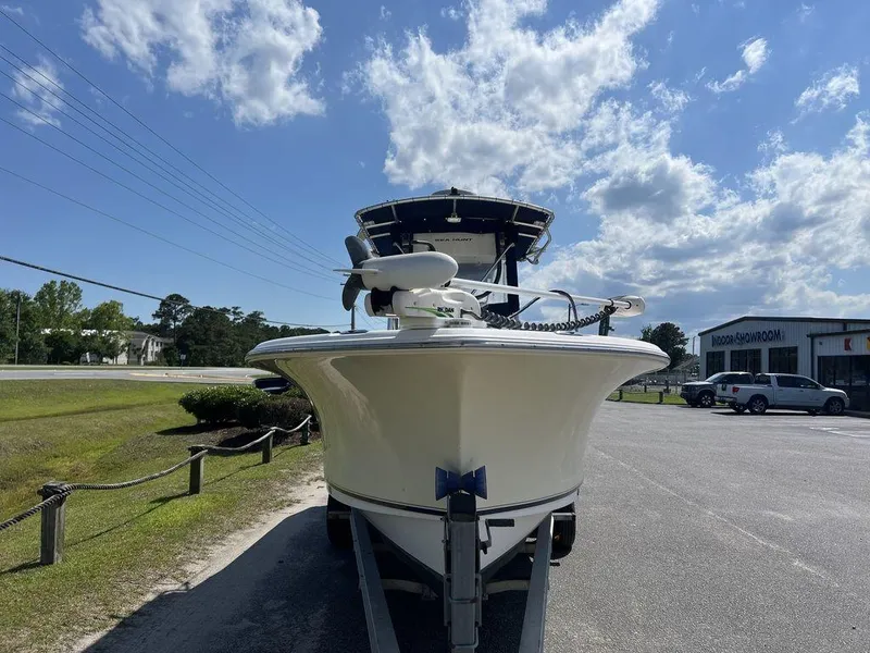 Slide: The Image of 2006 Sea Hunt Triton 260 boat on trailer under blue sky. - 7