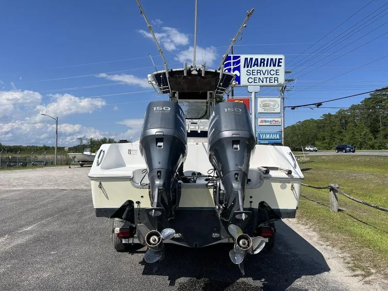 Slide: The Image of 2006 Sea Hunt Triton 260 boat with dual 150 horsepower engines at marine service center. - 8