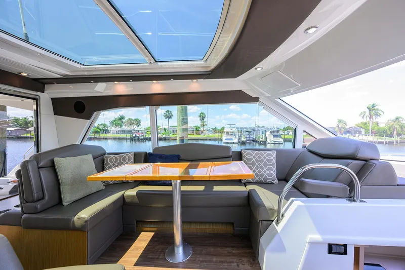 Slide: The Image of Luxurious 2015 Cruisers Cantius yacht interior with plush seating and panoramic windows. - 11