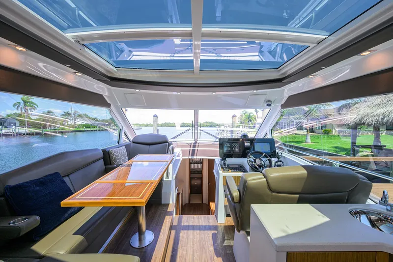 Slide: The Image of Luxurious 2015 Cruisers Cantius yacht interior with panoramic windows and modern seating. - 12