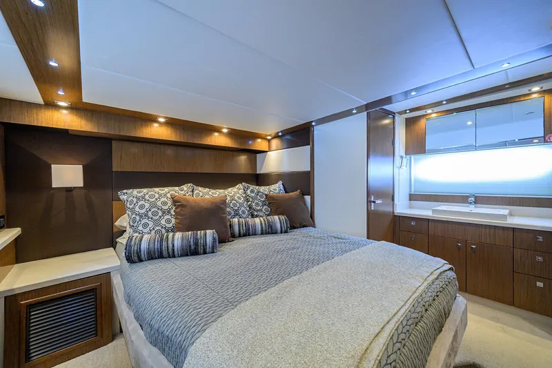 Slide: The Image of Luxurious 2015 Cruisers Cantius yacht bedroom with modern decor and ambient lighting. - 23