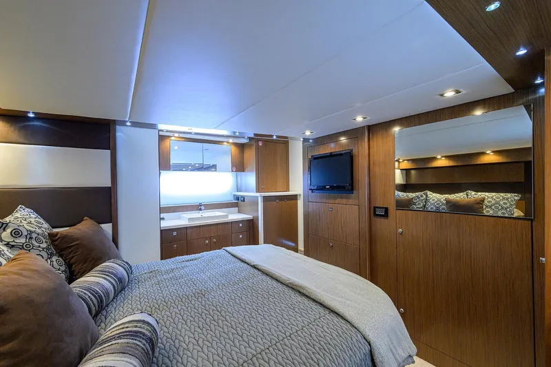 Slide: The Image of Luxurious 2015 Cruisers Cantius yacht bedroom with modern decor and ambient lighting. - 24