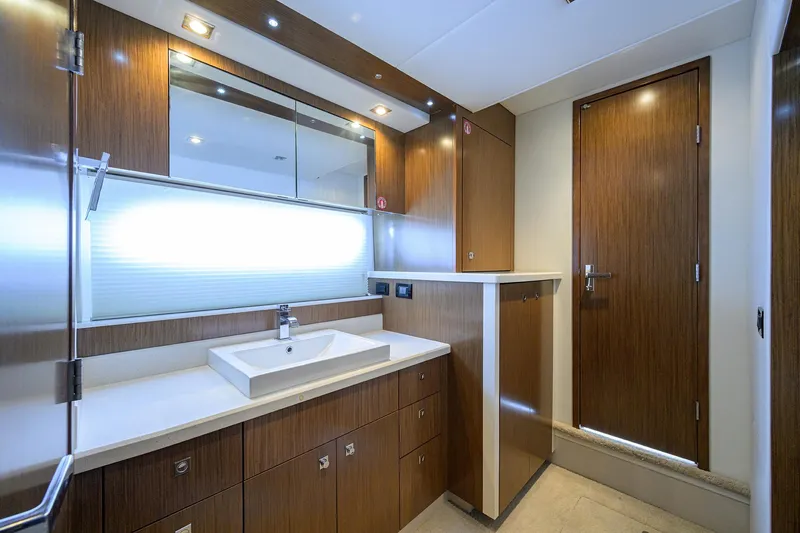 Slide: The Image of Luxurious 2015 Cruisers Cantius yacht bathroom with modern wood cabinetry and sleek fixtures. - 25