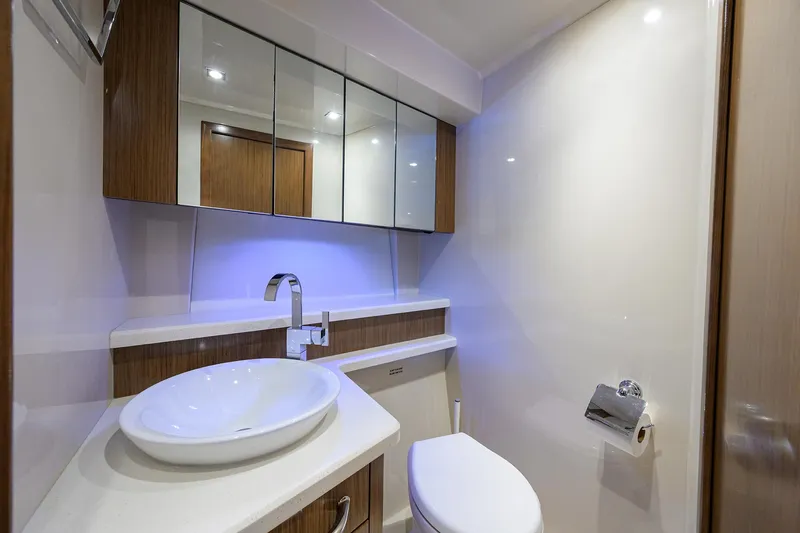 Slide: The Image of Luxurious bathroom in 2015 Cruisers Cantius yacht with modern fixtures and elegant design. - 29