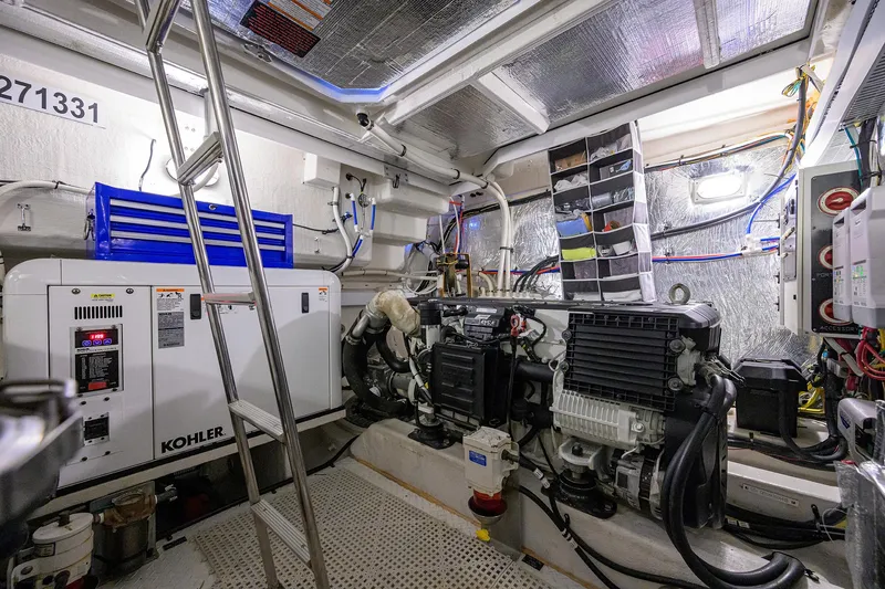 Slide: The Image of Engine room of a 2015 Cruisers Cantius yacht with Kohler generator and equipment. - 32