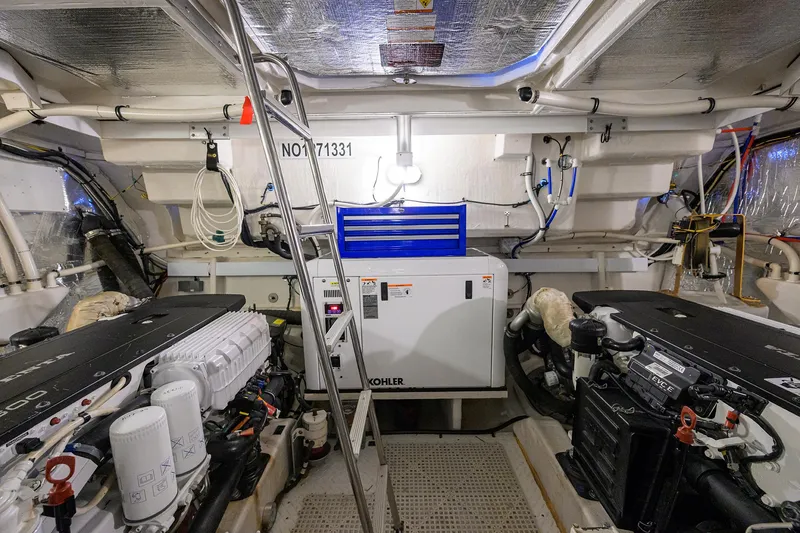 Slide: The Image of Engine room of 2015 Cruisers Cantius yacht with Kohler generator and dual engines. - 33