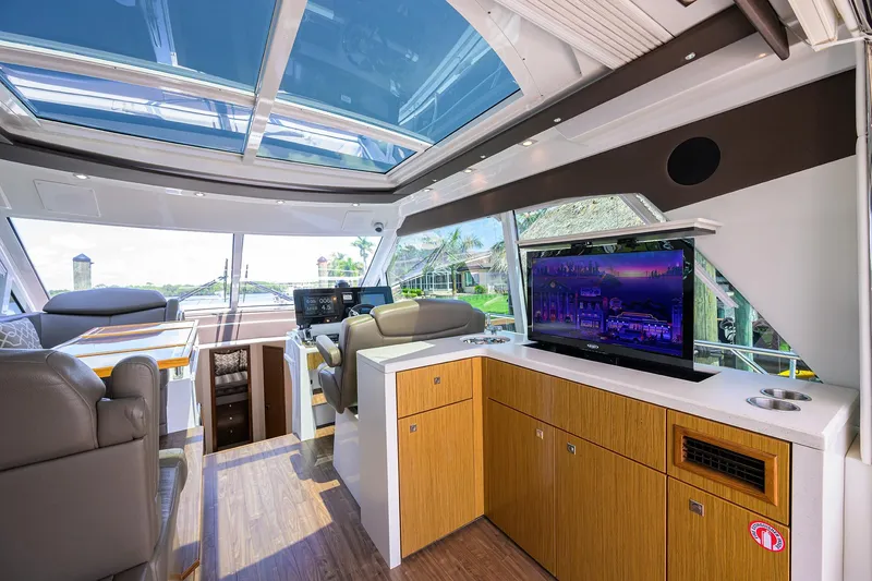 Slide: The Image of Luxurious 2015 Cruisers Cantius yacht interior with modern amenities and panoramic windows. - 9