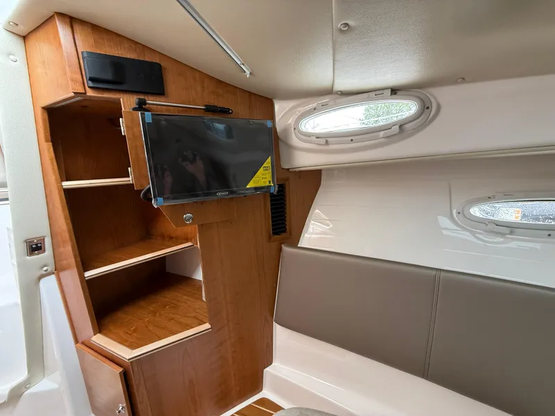 Slide: The Image of Interior of 2025 Cutwater C-32 C boat with wood cabinetry and seating. - 19