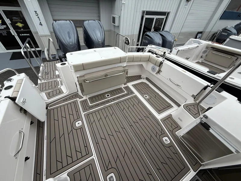 Slide: The Image of 2025 Cutwater C-32 C boat deck with seating and outboard motors. - 6