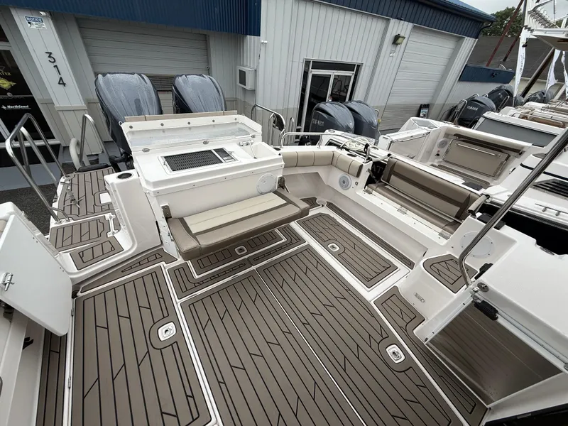 Slide: The Image of 2025 Cutwater C-32 C boat deck with seating and storage compartments. - 7