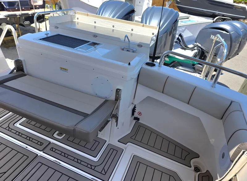 Slide: The Image of 2025 Cutwater C-32 CB boat deck with seating and Yamaha engines. - 4