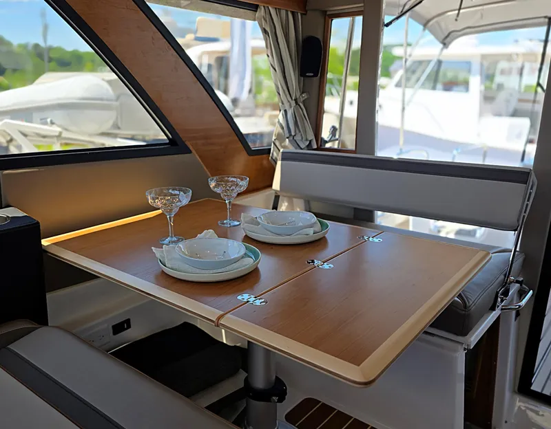 Slide: The Image of Interior of 2025 Cutwater C-32 CB yacht with elegant dining setup. - 7