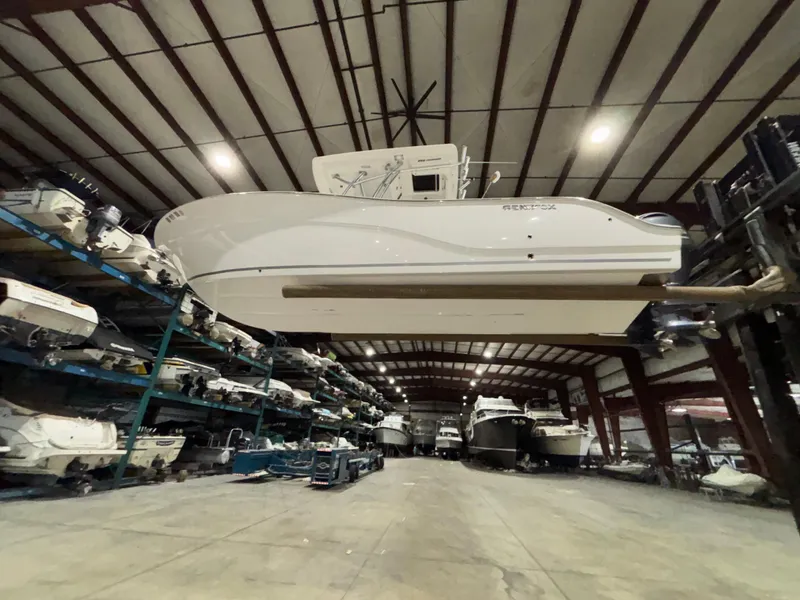 Slide: The Image of 2020 Sea Fox 266 Commander boat stored in a spacious indoor facility. - 11