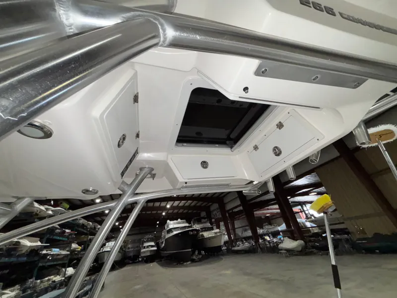 Slide: The Image of 2020 Sea Fox 266 Commander boat in storage, showcasing under-deck compartments and stainless steel fittings. - 16