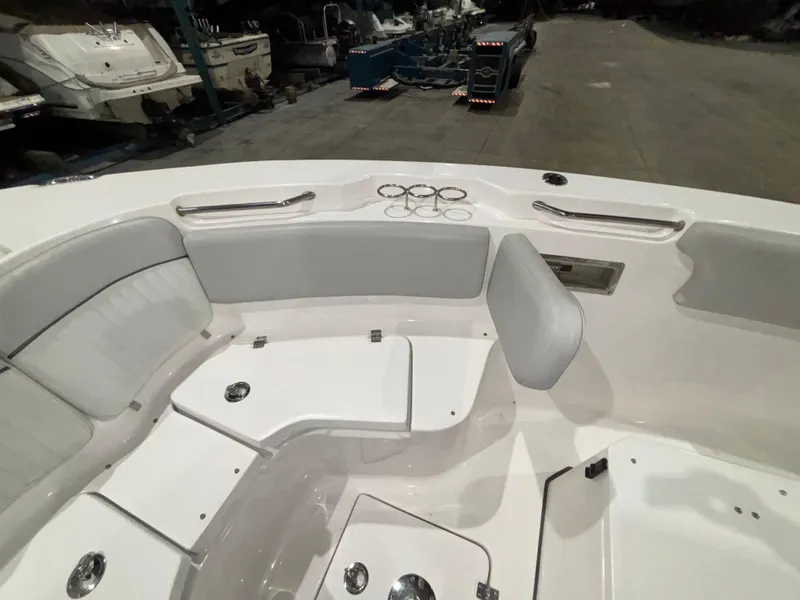 Slide: The Image of 2020 Sea Fox 266 Commander boat interior with white seating and cup holders. - 18